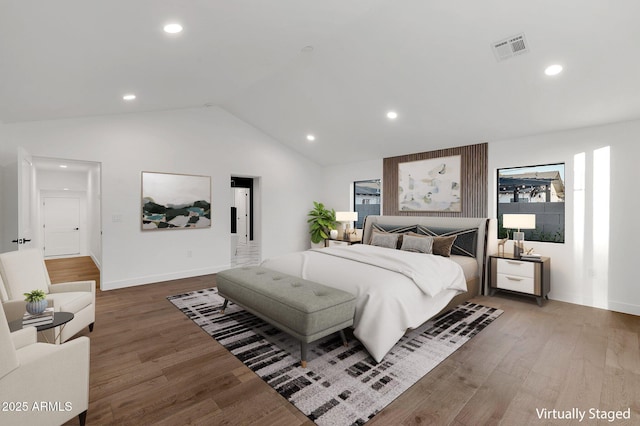 bedroom with visible vents, vaulted ceiling, dark wood-type flooring, and recessed lighting