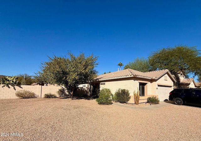 view of front of property with a garage