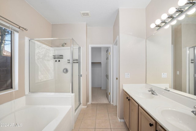 bathroom with vanity, independent shower and bath, and tile patterned floors