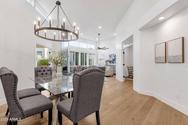 dining area with ceiling fan, recessed lighting, light wood-style flooring, and baseboards