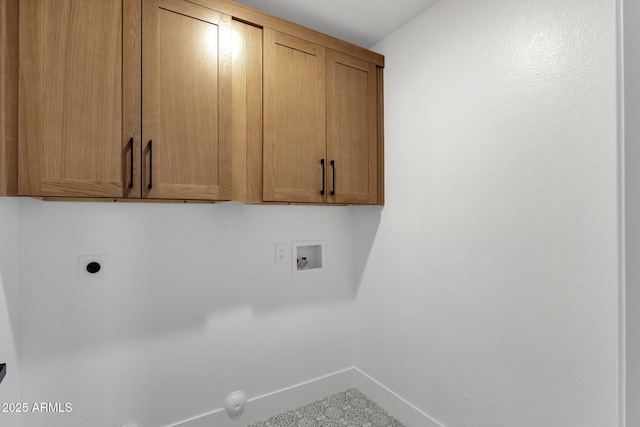 laundry area featuring cabinet space, baseboards, gas dryer hookup, washer hookup, and electric dryer hookup