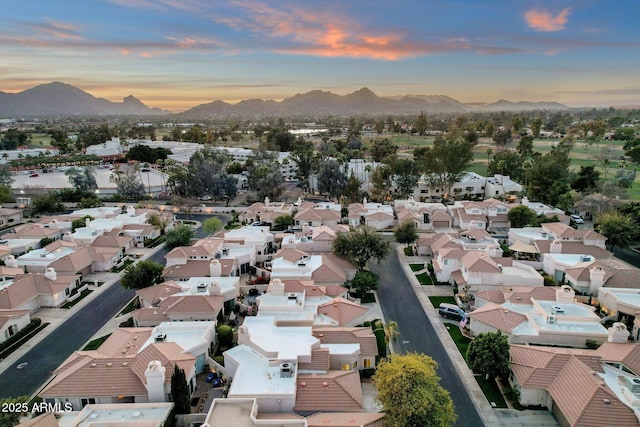 aerial view at dusk with a residential view and a mountain view