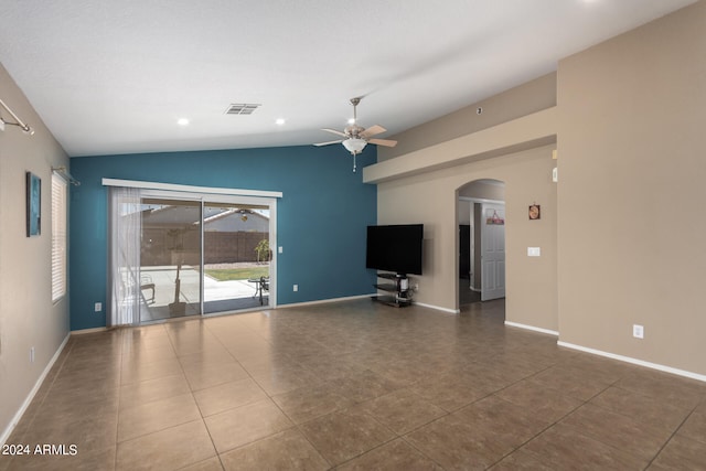 unfurnished living room with tile patterned floors, ceiling fan, and vaulted ceiling