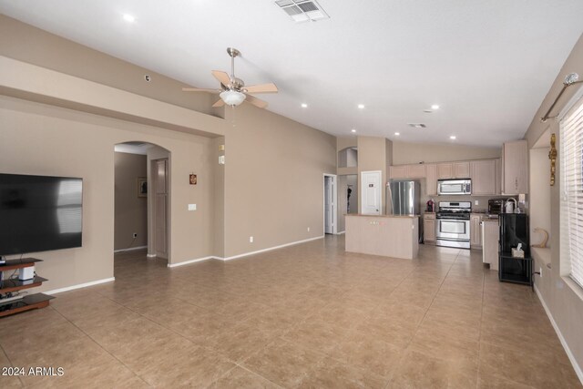 tiled living room featuring high vaulted ceiling and ceiling fan