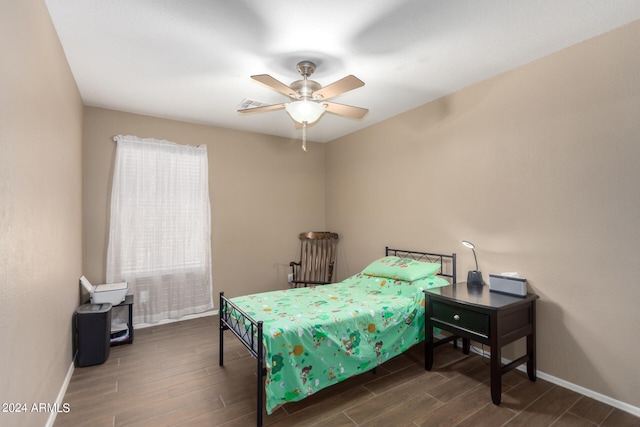 bedroom with wood-type flooring and ceiling fan