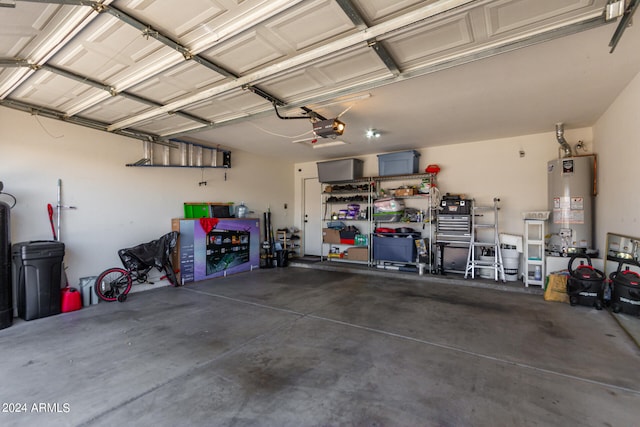 garage with a garage door opener and gas water heater