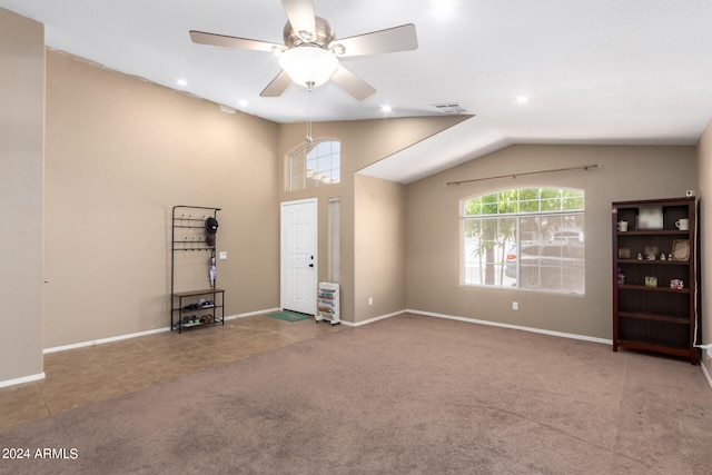 unfurnished living room featuring carpet, lofted ceiling, and ceiling fan