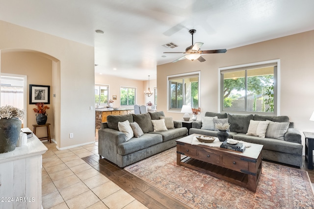 living room featuring light hardwood / wood-style floors and ceiling fan