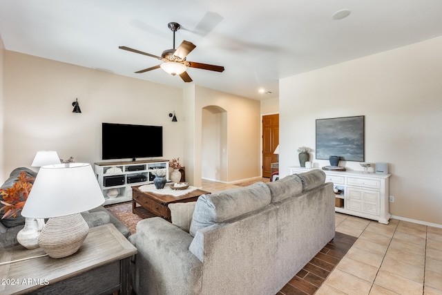 living room featuring light tile patterned flooring and ceiling fan