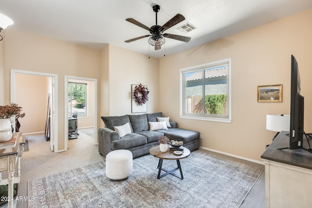 carpeted living room featuring a healthy amount of sunlight and ceiling fan