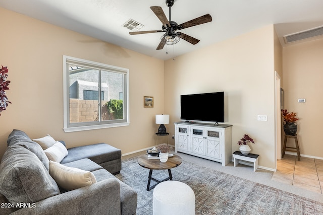 tiled living room with ceiling fan