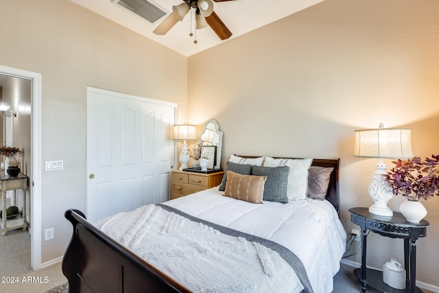 carpeted bedroom with ceiling fan and a closet