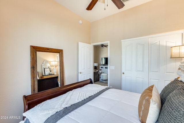 bedroom featuring high vaulted ceiling, ceiling fan, and a closet