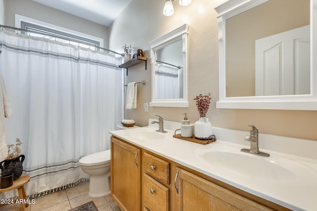 bathroom with vanity, tile patterned floors, and toilet