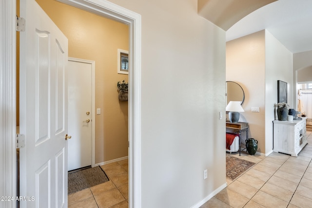 hallway featuring light tile patterned floors