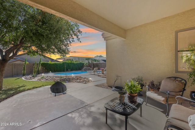 view of patio terrace at dusk