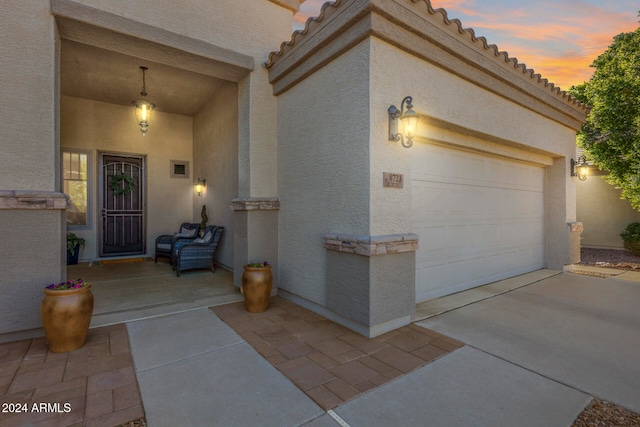 view of exterior entry at dusk