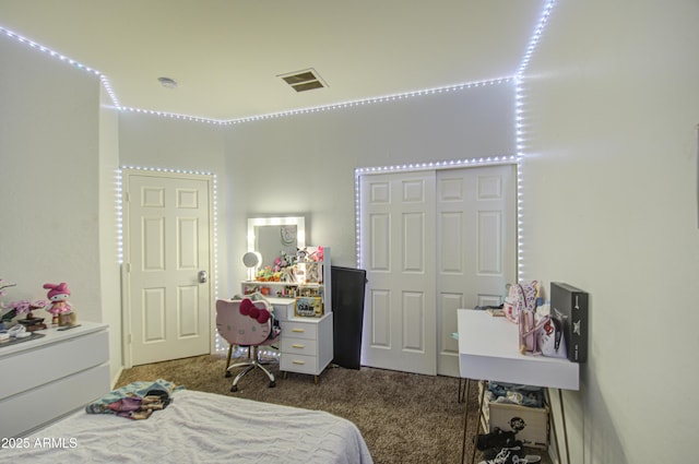 bedroom with carpet flooring and a closet