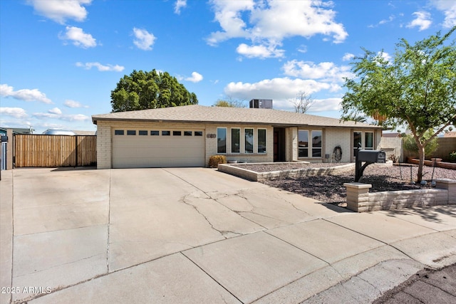 11621 N 39th Dr, Phoenix, AZ 85029 - ranch-style home with a garage, brick siding, fence, and concrete driveway