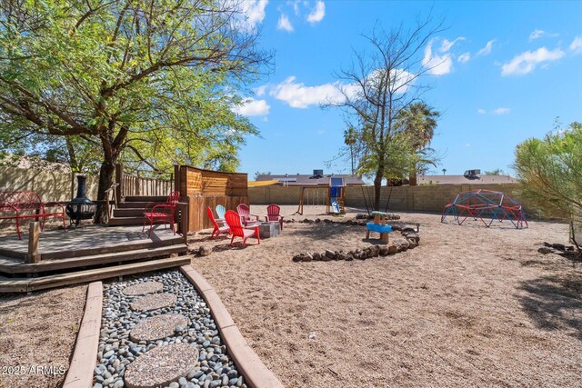 11621 N 39th Dr, Phoenix, AZ 85029 - view of yard with a fenced backyard, a playground, and a deck