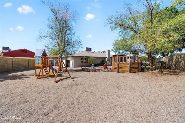 11621 N 39th Dr, Phoenix, AZ 85029 - rear view of house featuring a wooden deck, fence, and a playground