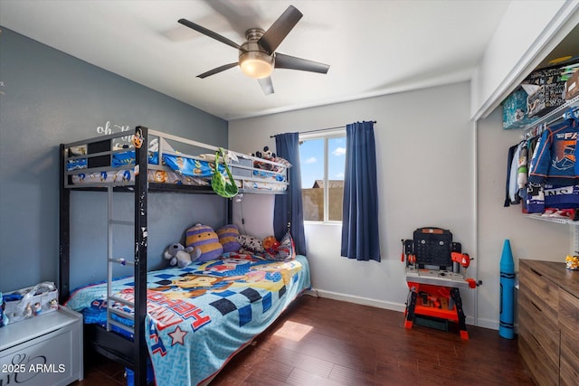 11621 N 39th Dr, Phoenix, AZ 85029 - bedroom with wood finished floors, baseboards, and a ceiling fan