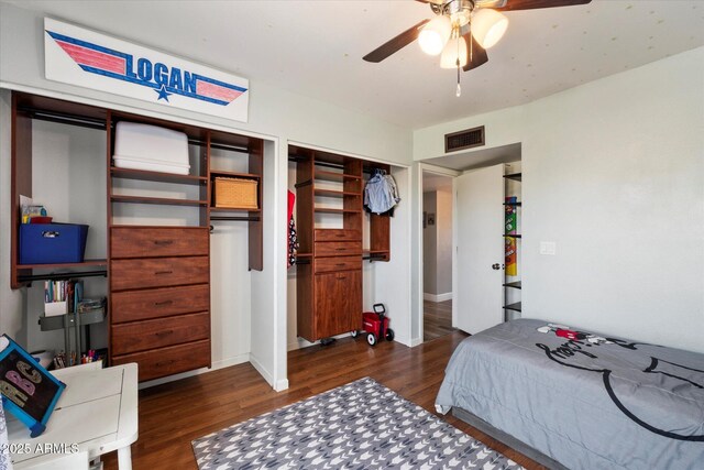 11621 N 39th Dr, Phoenix, AZ 85029 - bedroom featuring visible vents, multiple closets, ceiling fan, and wood finished floors