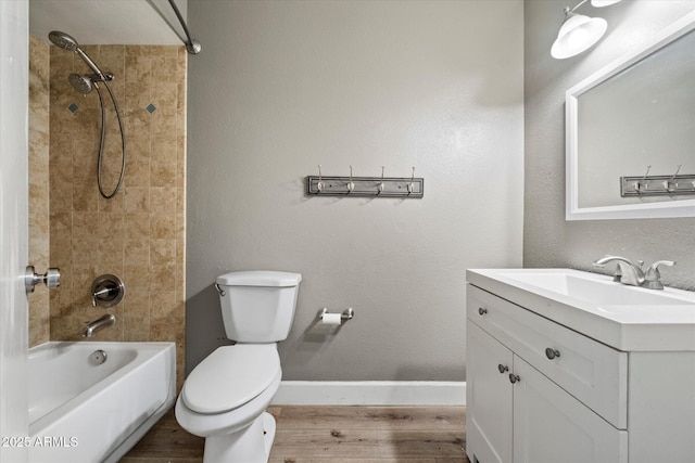 11621 N 39th Dr, Phoenix, AZ 85029 - bathroom featuring vanity, baseboards, toilet, bathtub / shower combination, and wood finished floors