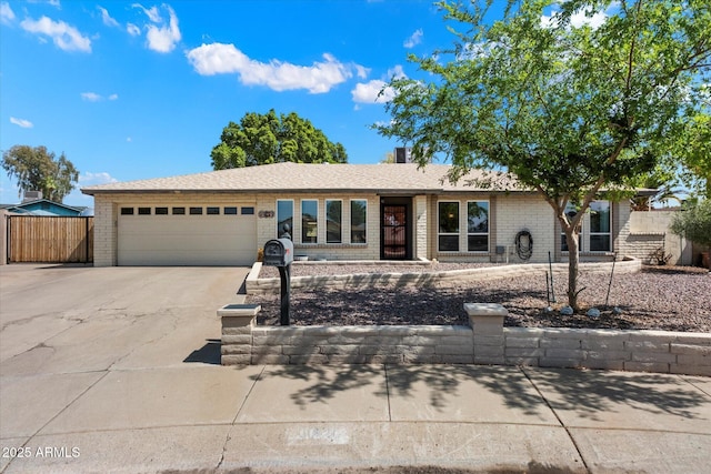 11621 N 39th Dr, Phoenix, AZ 85029 - single story home featuring a garage, brick siding, fence, and concrete driveway