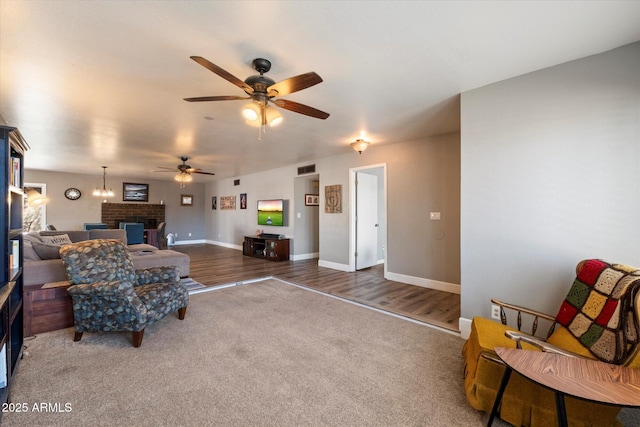 11621 N 39th Dr, Phoenix, AZ 85029 - carpeted living area with visible vents, ceiling fan, a brick fireplace, and baseboards