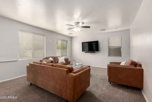 living room with dark carpet and ceiling fan