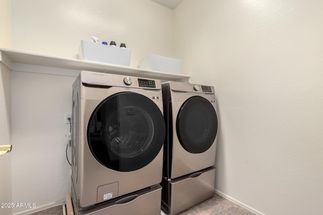 laundry room featuring independent washer and dryer