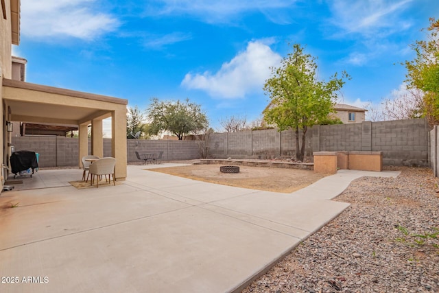 view of patio / terrace featuring a fire pit