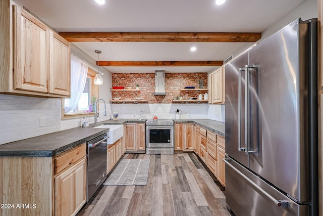 kitchen featuring pendant lighting, sink, decorative backsplash, appliances with stainless steel finishes, and beamed ceiling