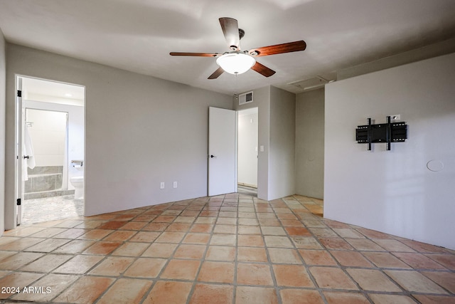 spare room with ceiling fan