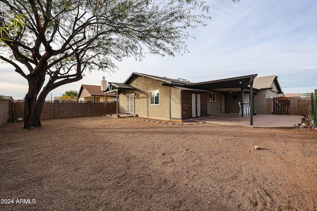 rear view of property featuring a patio