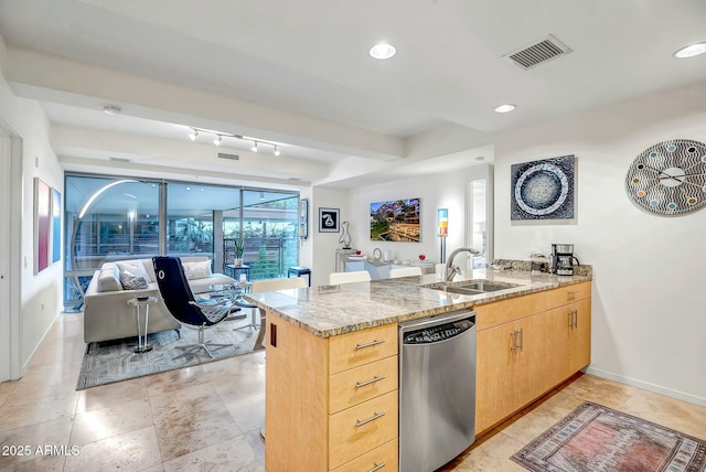 kitchen with a peninsula, a sink, visible vents, stainless steel dishwasher, and light stone countertops