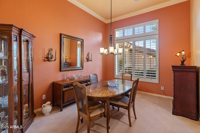 dining space with crown molding, light colored carpet, and an inviting chandelier