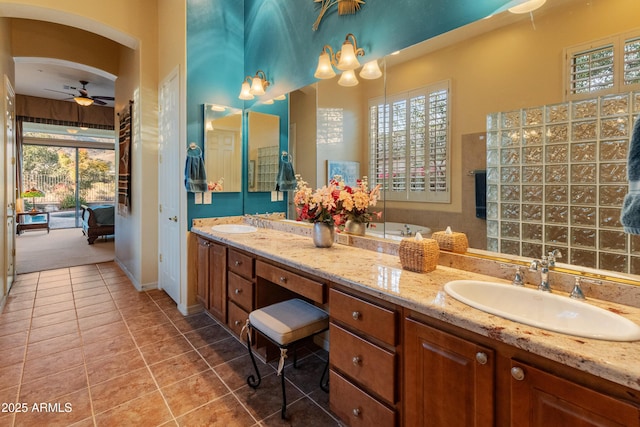 bathroom with ceiling fan, tile patterned floors, vanity, and a wealth of natural light