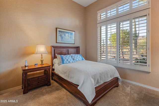 bedroom featuring light carpet