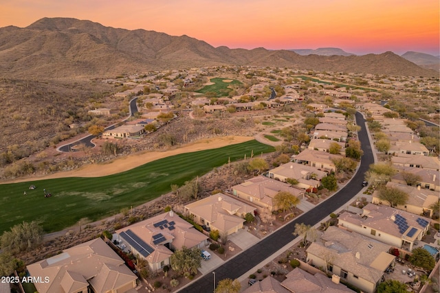 aerial view at dusk with a mountain view