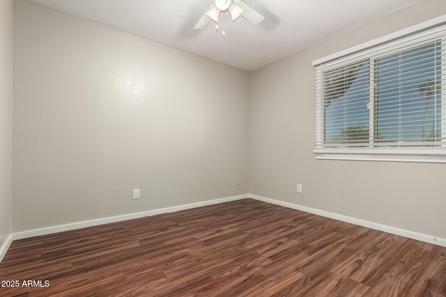 14408 N 35th Ave, Phoenix, AZ 85053 - spare room with dark wood-type flooring and ceiling fan