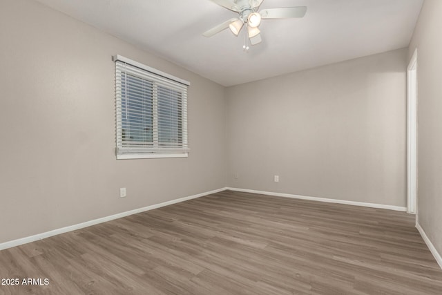 14408 N 35th Ave, Phoenix, AZ 85053 - empty room with wood-type flooring and ceiling fan