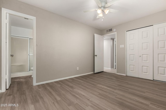 14408 N 35th Ave, Phoenix, AZ 85053 - unfurnished bedroom with hardwood / wood-style floors, ceiling fan, and a closet