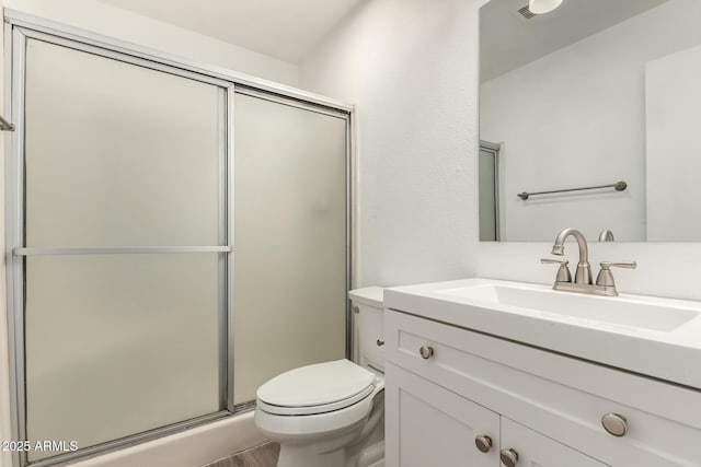 14408 N 35th Ave, Phoenix, AZ 85053 - bathroom featuring vanity, a shower with shower door, and toilet