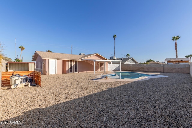 14408 N 35th Ave, Phoenix, AZ 85053 - rear view of house with a fenced in pool