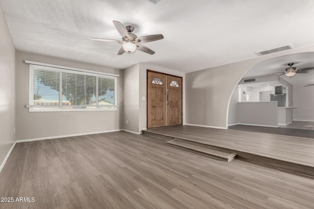 14408 N 35th Ave, Phoenix, AZ 85053 - entrance foyer with hardwood / wood-style flooring, ceiling fan, and a textured ceiling