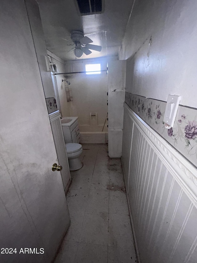 bathroom featuring toilet and ceiling fan