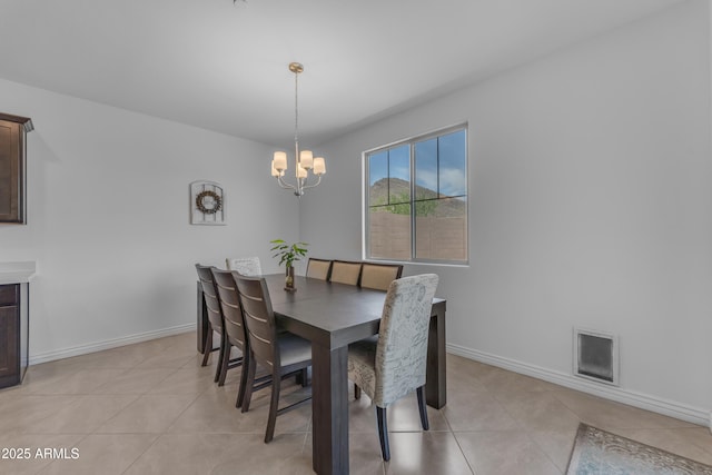 12370 W Cassia Trl, Peoria, AZ 85383 - dining area featuring a chandelier, light tile patterned floors, and baseboards