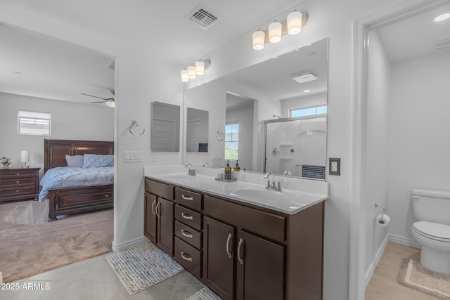 12370 W Cassia Trl, Peoria, AZ 85383 - bathroom featuring double vanity, ceiling fan, a stall shower, ensuite bathroom, and tile patterned floors